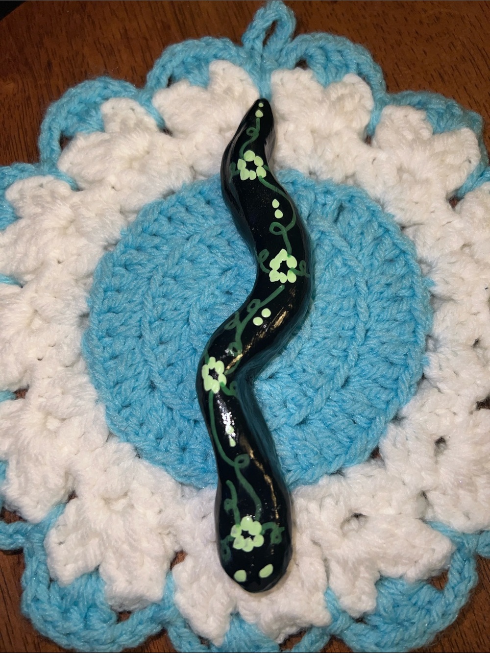Hand-Painted Black Ceramic Snake garden Ornament with Green Floral Accents